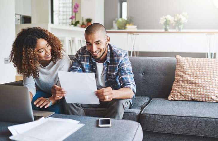 A couple going over their financial documents together.