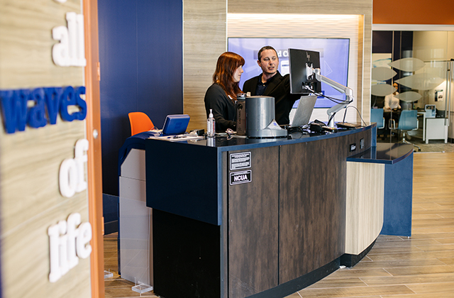 Associate serving members in the Federal Way Branch lobby