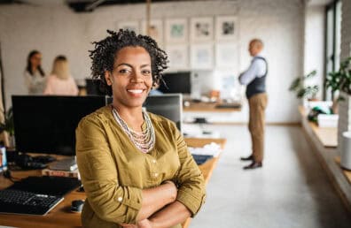 Ambitious woman standing in an office.