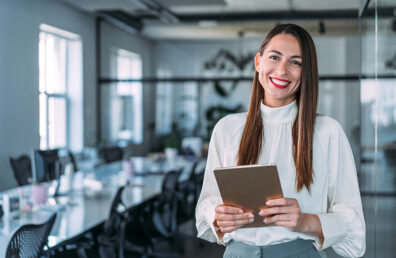 business expert preparing for presentation in empty conference room