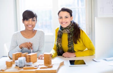 Two female architects working on a project.