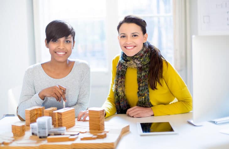 Two female architects working on a project.