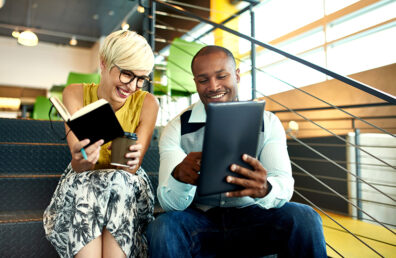 colleagues having a quick meeting on the stairs of their office space