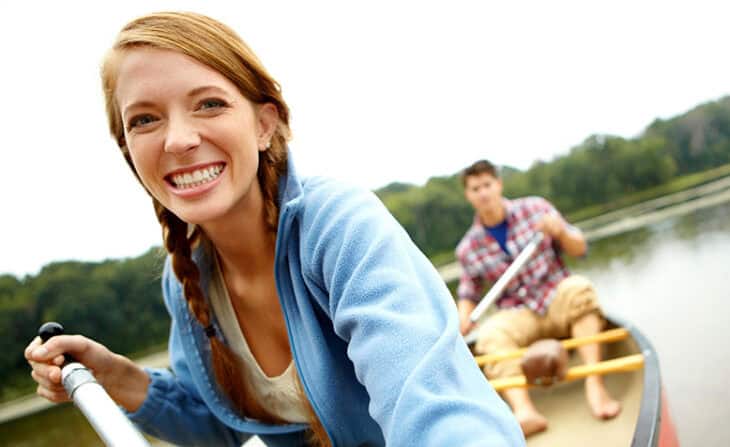 couple canoeing on a lake