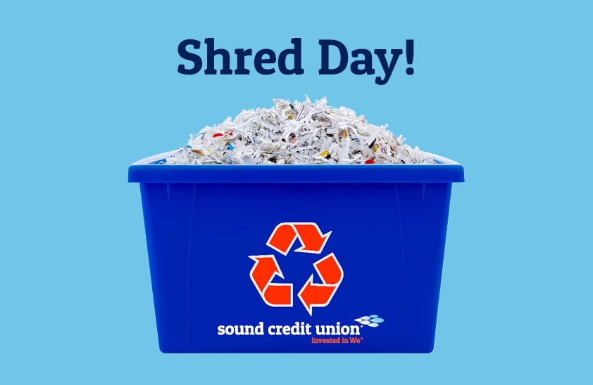 A recycle bin filled with shredded paper, on a sky blue background.