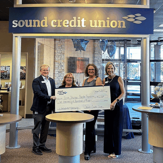 Employees of Sound presenting a check donation to North Thurston Education Foundation